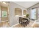 Cozy dining area with stylish seating and natural light streaming through the window at 9975 Peace Way # 2009, Las Vegas, NV 89147