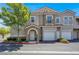 Charming townhome with well-maintained landscaping, attached garage and inviting front entryway at 9975 Peace Way # 2009, Las Vegas, NV 89147