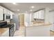 A kitchen featuring stainless steel appliances, granite countertops, and ample cabinet space at 9975 Peace Way # 2009, Las Vegas, NV 89147
