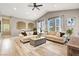 Bright living room featuring neutral-toned furniture, vaulted ceiling, and ample natural light at 9975 Peace Way # 2009, Las Vegas, NV 89147