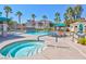 Community pool area with hot tub, lounge chairs, and well-maintained landscaping at 9975 Peace Way # 2009, Las Vegas, NV 89147