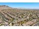 Aerial view of a well-planned suburban neighborhood with neatly arranged houses, curved streets, and picturesque mountain backdrops at 12269 Catanzaro Ave, Las Vegas, NV 89138