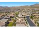 Neighborhood street view of a row of houses with landscaped yards and mountain views at 12269 Catanzaro Ave, Las Vegas, NV 89138