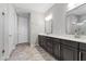 Bathroom featuring tile floors, double sinks and a walk in shower at 12269 Catanzaro Ave, Las Vegas, NV 89138