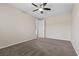 A spacious bedroom featuring carpeted floors and a ceiling fan with a light at 12269 Catanzaro Ave, Las Vegas, NV 89138