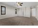 Bedroom featuring carpet, ceiling fan, and shuttered windows at 12269 Catanzaro Ave, Las Vegas, NV 89138