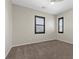 Bedroom featuring carpet floors, neutral walls, and windows with modern blinds at 12269 Catanzaro Ave, Las Vegas, NV 89138