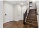 Welcoming entryway with hardwood floors, stairs, and multiple doors offering access to various rooms at 12269 Catanzaro Ave, Las Vegas, NV 89138