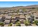 Exterior view of a neighborhood street with houses and mountain views at 12269 Catanzaro Ave, Las Vegas, NV 89138