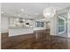 Gourmet kitchen boasts an expansive island, stainless appliances, and stone tile backsplash at 12269 Catanzaro Ave, Las Vegas, NV 89138