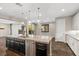 Kitchen island with sink and stainless dishwasher, overlooks the open living space at 12269 Catanzaro Ave, Las Vegas, NV 89138