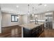 Spacious kitchen with island, stainless steel appliances, and hardwood floors at 12269 Catanzaro Ave, Las Vegas, NV 89138