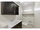 Laundry room featuring tile floors, and a laundry sink at 12269 Catanzaro Ave, Las Vegas, NV 89138