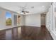 Living room featuring hardwood floors and sliding glass doors with mountain views at 12269 Catanzaro Ave, Las Vegas, NV 89138