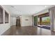 Spacious living room featuring hardwood floors, recessed lighting, and sliding doors to the outdoor area at 12269 Catanzaro Ave, Las Vegas, NV 89138