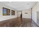 Living room with hardwood floors, large windows, and backyard access at 12269 Catanzaro Ave, Las Vegas, NV 89138