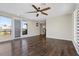 Living room with hardwood floors, exterior access, and picturesque mountain views at 12269 Catanzaro Ave, Las Vegas, NV 89138