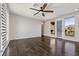 Living room showcasing hardwood floors, natural light, and scenic mountain views at 12269 Catanzaro Ave, Las Vegas, NV 89138