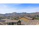 A stunning mountain range view from the rooftop overlooking the neighborhood at 12269 Catanzaro Ave, Las Vegas, NV 89138