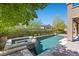 A sparkling pool and spa nestled in a private backyard with lush landscaping at 12269 Catanzaro Ave, Las Vegas, NV 89138