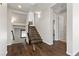 View of the wooden staircase, hardwood floors, white walls, and decorative lighting at 12269 Catanzaro Ave, Las Vegas, NV 89138