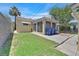 Backyard featuring a lawn, patio, and mature tree providing shade at 1331 Melville Dr, Las Vegas, NV 89102