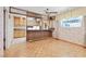 Dining room next to kitchen includes wood floors and natural light at 1331 Melville Dr, Las Vegas, NV 89102