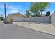 Street view of the property showcasing a detached garage and parking area at 1331 Melville Dr, Las Vegas, NV 89102