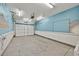 Empty garage interior with painted walls, overhead lighting, and a garage door at 1331 Melville Dr, Las Vegas, NV 89102