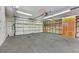 Spacious garage with ample storage, including shelves and cabinets at 1331 Melville Dr, Las Vegas, NV 89102