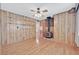Spacious living room features hardwood floors and a vintage wood burning stove at 1331 Melville Dr, Las Vegas, NV 89102