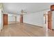 Bright living room showcasing hardwood floors, mirrored wall, and ample natural light at 1331 Melville Dr, Las Vegas, NV 89102