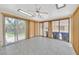 A well-lit room with tiled floors and multiple sliding glass doors at 1331 Melville Dr, Las Vegas, NV 89102