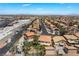 An aerial view of a residential neighborhood with shopping area, showcasing community and convenience at 1403 Graystone Canyon Ave, Las Vegas, NV 89183
