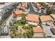 Aerial view of backyard with pool, lawn, desert landscaping, mature trees, and RV parking at 1403 Graystone Canyon Ave, Las Vegas, NV 89183