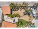 Aerial view of backyard with RV parking, desert landscaping, trees and lawn at 1403 Graystone Canyon Ave, Las Vegas, NV 89183