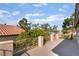 Spacious balcony with wrought iron railings and views of trees and rooftops at 1403 Graystone Canyon Ave, Las Vegas, NV 89183