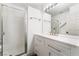 Bathroom featuring an all-white vanity, a shower, and an illuminated mirror at 1403 Graystone Canyon Ave, Las Vegas, NV 89183