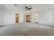 Expansive bedroom with neutral carpet, ceiling fan, and ample space, creating a comfortable and inviting atmosphere at 1403 Graystone Canyon Ave, Las Vegas, NV 89183