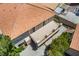 Aerial view of home featuring a balcony, desert landscaping, and a tile roof at 1403 Graystone Canyon Ave, Las Vegas, NV 89183