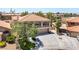Two-story home with neutral colors, a balcony, and a three-car garage at 1403 Graystone Canyon Ave, Las Vegas, NV 89183