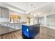 Beautiful kitchen features granite counters, gray cabinets, and a dark blue kitchen island at 1403 Graystone Canyon Ave, Las Vegas, NV 89183