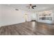 Open-concept living room with modern flooring, seamlessly connected to the kitchen, perfect for entertaining and Gathering living at 1403 Graystone Canyon Ave, Las Vegas, NV 89183