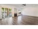 Spacious living room with a fireplace and sliding glass doors to the backyard at 1403 Graystone Canyon Ave, Las Vegas, NV 89183