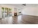 Spacious living room with a fireplace and sliding glass doors to the backyard at 1403 Graystone Canyon Ave, Las Vegas, NV 89183