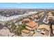 This aerial shot showcases the neighborhood, nearby commercial properties, and mountain views at 1403 Graystone Canyon Ave, Las Vegas, NV 89183