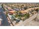 This is an aerial view of the neighborhood, complete with mature trees, pools, and tile roofs at 1403 Graystone Canyon Ave, Las Vegas, NV 89183