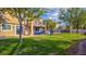 Lush backyard with a view of the home's patio, balcony, and well-maintained lawn at 1513 Ravanusa Dr, Henderson, NV 89052