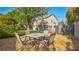 Expansive backyard featuring a well-manicured lawn and patio, offering ample space for outdoor activities at 1513 Ravanusa Dr, Henderson, NV 89052