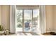 Outdoor balcony with beautiful view, glass sliding doors, neutral walls and a nice seating area at 1513 Ravanusa Dr, Henderson, NV 89052